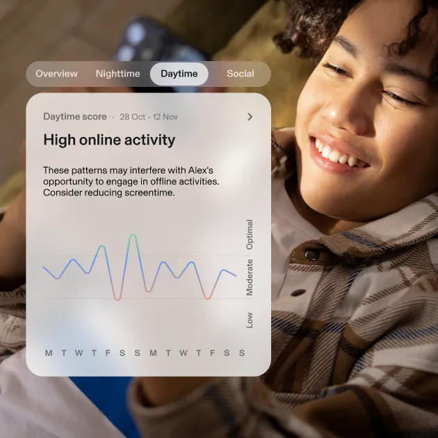 Young child looking at phone. Aura UI: Daytime - High online activity.